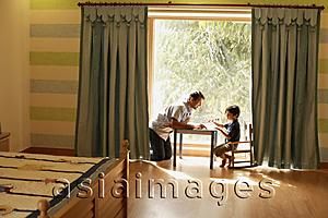 Asia Images Group - father and son playing at table