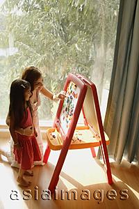Asia Images Group - mother and daughter at easel