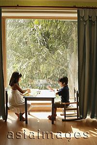 Asia Images Group - two children playing at table