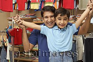 Asia Images Group - father and son in shop