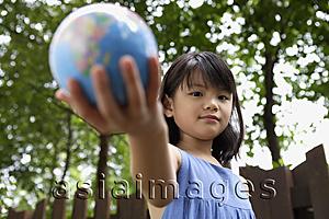 Asia Images Group - Girl holding out globe