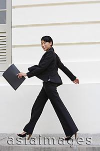 Asia Images Group - Business woman walking