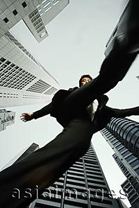 Asia Images Group - Bottom view of businessman walking