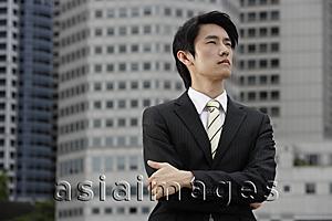 Asia Images Group - Portrait of businessman with arms crossed