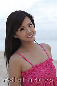Asia Images Group - Woman smiling on beach