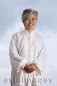 Asia Images Group - Older woman in Chinese traditional clothing.