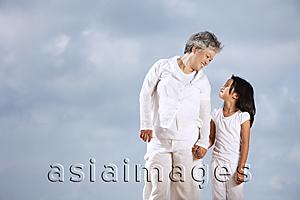 Asia Images Group - Older woman and young girl looking at each other.