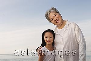Asia Images Group - Older woman hugging young woman.