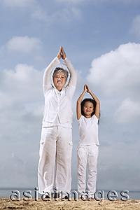 Asia Images Group - Older woman and young girl exercising.