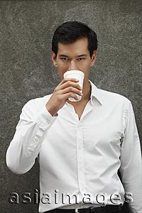 Asia Images Group - man in white shirt drinking coffee