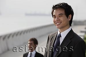 Asia Images Group - Chinese man looking at view and smiling