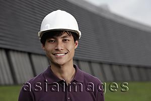 Asia Images Group - Chinese man wearing construction hat smiling
