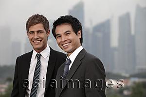 Asia Images Group - Chinese man and Caucasian man standing in front of buildings