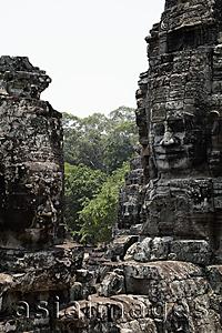 Asia Images Group - stone carving of Buddha's face, Angkor Wat Cambodia