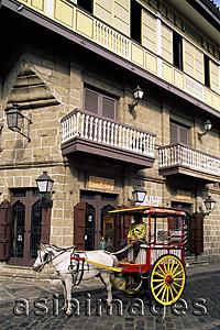 Asia Images Group - Philippines,Manila,Calesa or Horse-drawn Carriage and Spanish Colonial Building in the Intramuros Historical District