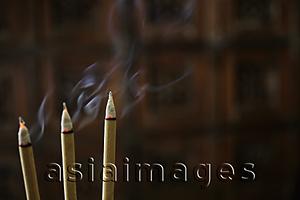 Asia Images Group - Incense sticks burning with smoke