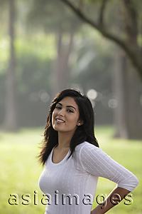 Asia Images Group - Half shot of Indian woman smiling outdoors