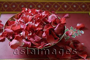 Asia Images Group - Red rose petals in bronze bowl