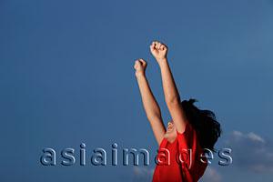 Asia Images Group - Young boy with red shirt with hands outstretched