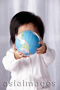 Asia Images Group - Baby holding small globe