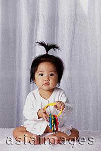 Asia Images Group - Chinese baby with pony tail,  holding toy keys