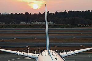 Asia Images Group - Close up of tail of airplane with the sun behind, Narita Airport, Japan