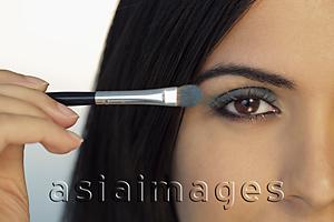 Asia Images Group - Cropped shot of young woman putting on eye make up.
