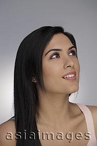 Asia Images Group - Head shot of young woman looking up