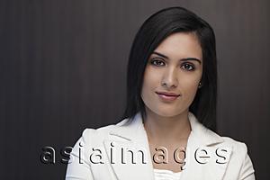 Asia Images Group - Head shot of young woman wearing suit and smiling