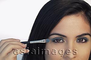 Asia Images Group - Cropped shot of woman putting on eye makeup