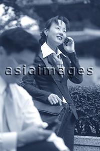 Asia Images Group - Executives using cellular phones