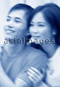 Asia Images Group - Couple looking off camera (motion blur)