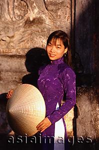Asia Images Group - Vietnam, Hue, the Citadel,  woman in traditional dress