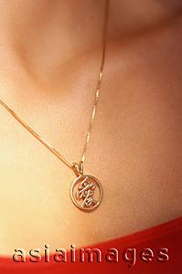 Asia Images Group - Woman wearing gold chain with pendant