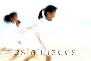 Asia Images Group - Children in white clothing running (motion blur)