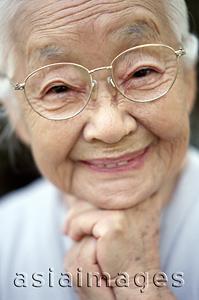 Asia Images Group - Mature woman with glasses smiling, portrait