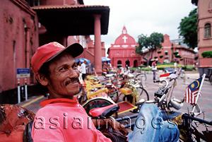 Asia Images Group - Malaysia, Malacca, pedicab driver infront of the Stadhuys.