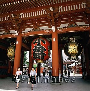Asia Images Group - Japan, Tokyo, Asakusa, tourists walking out the Hozomon Gate at Kannon Temple