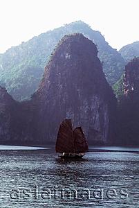 Asia Images Group - Vietnam, Halong Bay, Fishing junk sailing amongst the islands