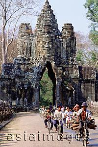 Asia Images Group - Cambodia, Angkor Thom, cyclists leaving the south gate