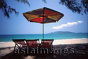Asia Images Group - Vietnam, Beach chairs and umbrella on Nha Trang Beach