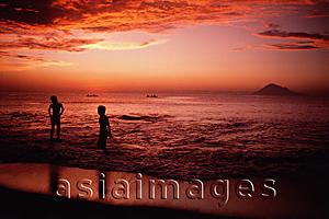 Asia Images Group - Indonesia, Sulawesi, Manado, Sunset on beach at Bunaken Island.