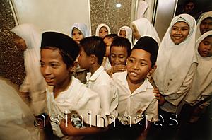 Asia Images Group - Malaysia, Kuala Lumpur, Muslim students filing out of classroom for their mid-morning snack at the National Mosque.