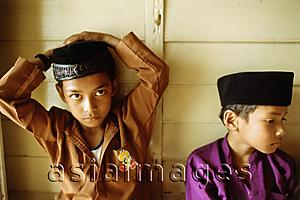 Asia Images Group - Malaysia, Kota Bharu, Young boys in traditional garb waiting for their Koran reading class to begin.