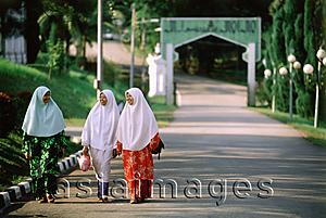 Asia Images Group - Malaysia, Johor Bahru, Muslim girls walking down a street.