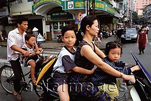 Asia Images Group - Vietnam, Ho Chi Minh City, Motorcycles and bicycles are used as an efficient means of transportation throughout Vietnam.