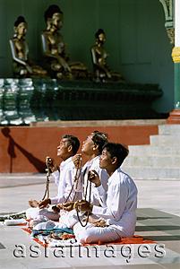 Asia Images Group - Myanmar (Burma), Yangon (Rangoon), Worshippers praying at the Shwedagon Pagoda