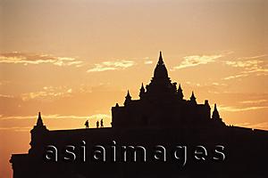Asia Images Group - Myanmar (Burma), Bagan, Silhouette of people on temple at Bagan at sunset