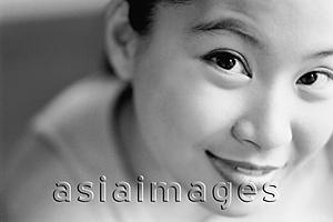 Asia Images Group - Young woman looking up, smiling.