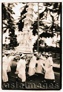 Asia Images Group - Indonesia, Bali, Gianyar, Men carrying funeral tower (bade) to temple. (artistic grain)